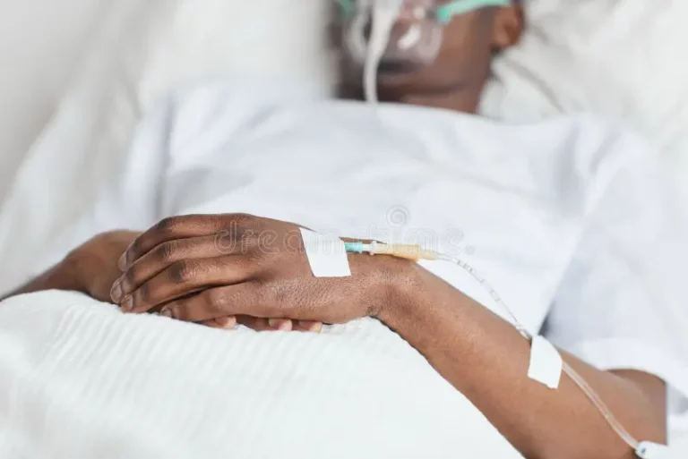 sick-african-american-man-hospital-close-up-unrecognizable-african-american-man-lying-white-hospital-bed-focus-iv-215244787