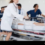 hospital-staff-rushing-patient-to-operating-room-DAM0D2
