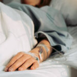 Asian woman lying sick in hospital.